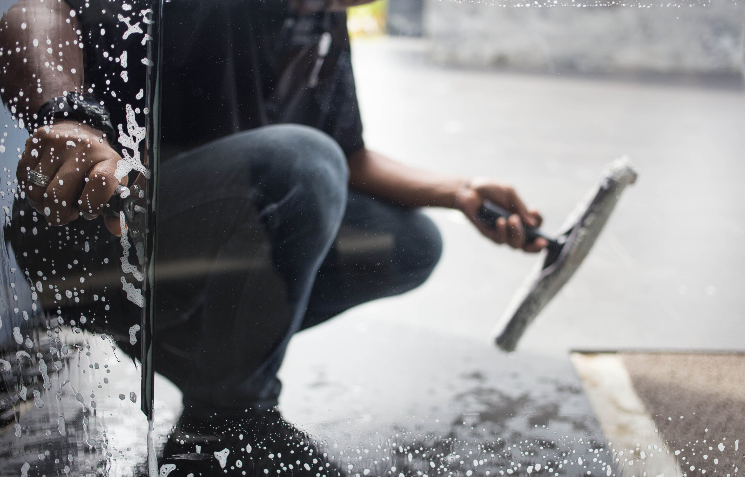 Cleaning,Windows,With,A,Squeegee